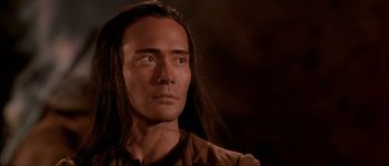 Movie still from “Brotherhood of the Wolf” (2001), directed by Christophe Gans – A person with long black hair; Close Up shot, Over the shoulder angle