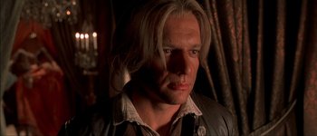 Movie still from “Brotherhood of the Wolf” (2001), directed by Christophe Gans – A person with long blonde hair; Close Up shot, Over the shoulder angle