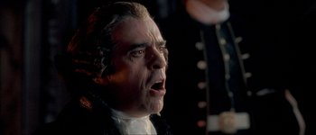 Movie still from “Brotherhood of the Wolf” (2001), directed by Christophe Gans – A person wearing a costume; Close Up shot, Low angle