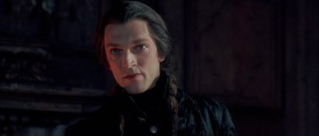 Movie still from “Brotherhood of the Wolf” (2001), directed by Christophe Gans – A person with long black hair; Close Up shot, Low angle