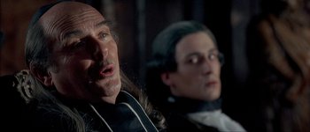 Movie still from “Brotherhood of the Wolf” (2001), directed by Christophe Gans – A man and a woman are standing next to each other; Close Up shot, Over the shoulder angle