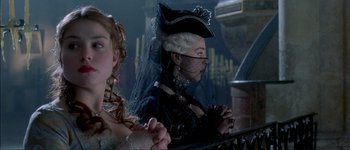 Movie still from “Brotherhood of the Wolf” (2001), directed by Christophe Gans – Two women dressed up in period clothing and makeup; Close Up shot, Over the shoulder angle