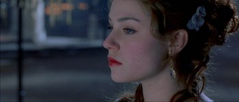 Movie still from “Brotherhood of the Wolf” (2001), directed by Christophe Gans – A person wearing a red lipstick; Close Up shot, Over the shoulder angle