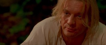 Movie still from “Brotherhood of the Wolf” (2001), directed by Christophe Gans – A person wearing a white shirt; Close Up shot, Over the shoulder angle
