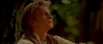 Movie still from “Brotherhood of the Wolf” (2001), directed by Christophe Gans – A man with blonde hair looking up into the sky; Close Up shot, Low angle