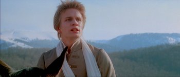 Movie still from “Brotherhood of the Wolf” (2001), directed by Christophe Gans – A man with a scarf around his neck and wearing a jacket; Close Up shot, Low angle