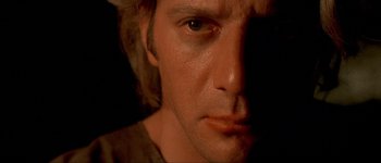 Movie still from “Brotherhood of the Wolf” (2001), directed by Christophe Gans – A man's face in the dark; Close Up shot, Low angle