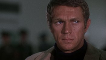 Movie still from “Bullitt” (1968), directed by Peter Yates – A person wearing a jacket; Close Up shot, Over the shoulder angle