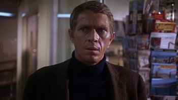 Movie still from “Bullitt” (1968), directed by Peter Yates – A person wearing a jacket; Close Up shot, Over the shoulder angle