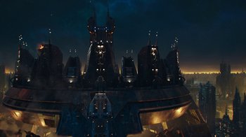 Movie still from “Bumblebee” (2018), directed by Travis Knight – An aerial view of a city at night with lights on; Extreme Wide shot, Overhead angle