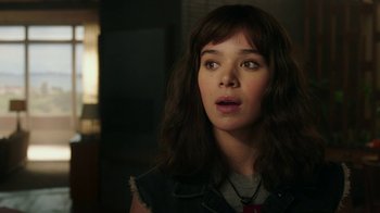 Movie still from “Bumblebee” (2018), directed by Travis Knight – A young woman with long brown hair looking upward; Close Up shot, Over the shoulder angle