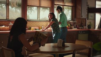Movie still from “Bumblebee” (2018), directed by Travis Knight – A man and a woman in a kitchen preparing a meal; Medium shot, High angle