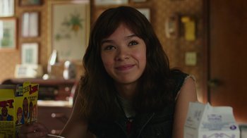 Movie still from “Bumblebee” (2018), directed by Travis Knight – A young woman sitting at a dining room table; Close Up shot, Over the shoulder angle