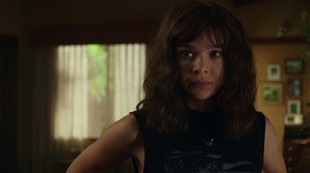 Movie still from “Bumblebee” (2018), directed by Travis Knight – A person wearing a black shirt; Close Up shot, Over the shoulder angle