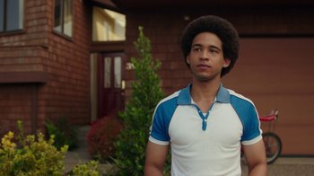 Movie still from “Bumblebee” (2018), directed by Travis Knight – A young man standing in front of a house; Close Up shot, Over the shoulder angle