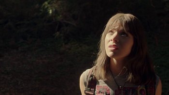 Movie still from “Bumblebee” (2018), directed by Travis Knight – A woman with long brown hair looking up at the sky; Close Up shot, Low angle