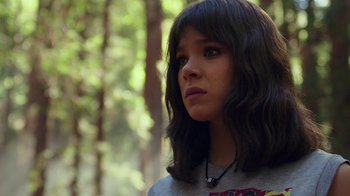 Movie still from “Bumblebee” (2018), directed by Travis Knight – A young woman with long black hair looking to her left; Close Up shot, Over the shoulder angle