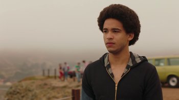 Movie still from “Bumblebee” (2018), directed by Travis Knight – A young man with a black shirt and a black jacket; Close Up shot, Over the shoulder angle