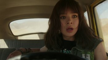 Movie still from “Bumblebee” (2018), directed by Travis Knight – A woman sitting in the driver's seat of a car; Close Up shot, Over the shoulder angle