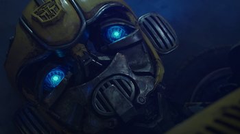 Movie still from “Bumblebee” (2018), directed by Travis Knight – View of the face of a robot; Extreme Close Up shot, Low angle