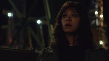 Movie still from “Bumblebee” (2018), directed by Travis Knight – A young woman with long brown hair wearing a black jacket; Close Up shot, Low angle