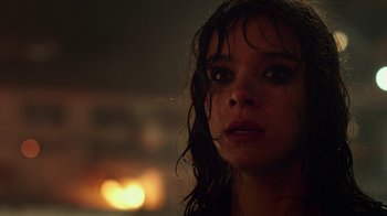 Movie still from “Bumblebee” (2018), directed by Travis Knight – A young woman with wet hair and a candle in the background; Close Up shot, Low angle