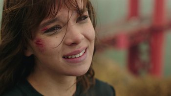 Movie still from “Bumblebee” (2018), directed by Travis Knight – A person smiling with makeup on; Close Up shot, High angle