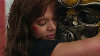 Movie still from “Bumblebee” (2018), directed by Travis Knight – A woman with red and black makeup on her face; Close Up shot, Over the shoulder angle
