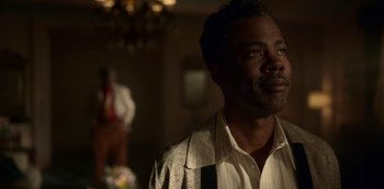 Movie still from “Fargo” (2014), created by Noah Hawley – A man in a white shirt is looking at the camera; Close Up shot, Over the shoulder angle