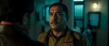 Movie still from “Bunty Aur Babli 2” (2021), directed by Varun V. Sharma – A person wearing a jacket; Close Up shot, Over the shoulder angle