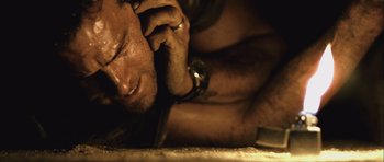 Movie still from “Buried” (2010), directed by Rodrigo Cortés – A person talking on a cell phone; Close Up shot, Overhead angle