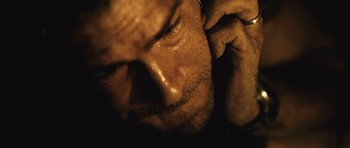 Movie still from “Buried” (2010), directed by Rodrigo Cortés – A man's face in the dark; Extreme Close Up shot, High angle