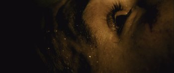 Movie still from “Buried” (2010), directed by Rodrigo Cortés – View of a woman's eye with long eyelashes; Extreme Close Up shot, Overhead angle