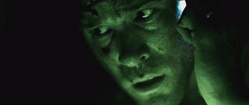 Movie still from “Buried” (2010), directed by Rodrigo Cortés – A man's face in the dark; Extreme Close Up shot, Overhead angle