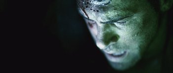 Movie still from “Buried” (2010), directed by Rodrigo Cortés – A person's face with green makeup; Extreme Close Up shot, Overhead angle