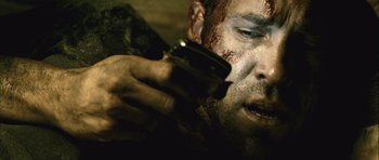 Movie still from “Buried” (2010), directed by Rodrigo Cortés – A person holding a cell phone; Close Up shot, Low angle