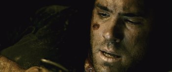Movie still from “Buried” (2010), directed by Rodrigo Cortés – A man's face covered in dirt; Extreme Close Up shot, High angle