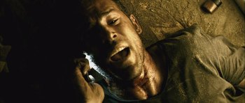 Movie still from “Buried” (2010), directed by Rodrigo Cortés – A person talking on a cell phone; Close Up shot, Overhead angle