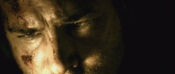 Movie still from “Buried” (2010), directed by Rodrigo Cortés – A man's face in the dark; Extreme Close Up shot, Low angle