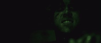 Movie still from “Buried” (2010), directed by Rodrigo Cortés – A person's face in the dark; Extreme Close Up shot, Overhead angle