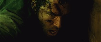 Movie still from “Buried” (2010), directed by Rodrigo Cortés – A person's face in the dark; Extreme Close Up shot, Overhead angle