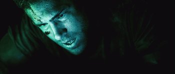 Movie still from “Buried” (2010), directed by Rodrigo Cortés – A man's face in the dark; Close Up shot, Low angle