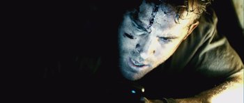 Movie still from “Buried” (2010), directed by Rodrigo Cortés – A person looking at a cell phone; Extreme Close Up shot, Overhead angle