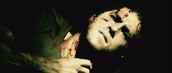 Movie still from “Buried” (2010), directed by Rodrigo Cortés – A person holding something in his hand; Extreme Close Up shot, High angle