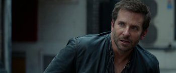 Movie still from “Burnt” (2015), directed by John Wells – A person wearing a leather jacket; Close Up shot, Over the shoulder angle