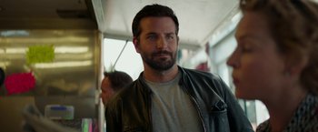 Movie still from “Burnt” (2015), directed by John Wells – A person wearing a leather jacket; Close Up shot, Over the shoulder angle