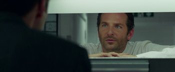 Movie still from “Burnt” (2015), directed by John Wells – A person sitting in front of a mirror; Close Up shot, Over the shoulder angle
