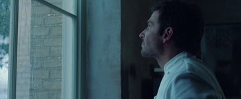 Movie still from “Burnt” (2015), directed by John Wells – A person looking out of a window; Close Up shot, Low angle