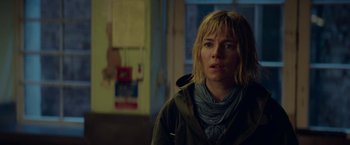 Movie still from “Burnt” (2015), directed by John Wells – A woman in a green jacket is standing in a room; Close Up shot, Low angle