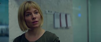 Movie still from “Burnt” (2015), directed by John Wells – A woman with blonde hair is looking at the camera; Close Up shot, Over the shoulder angle